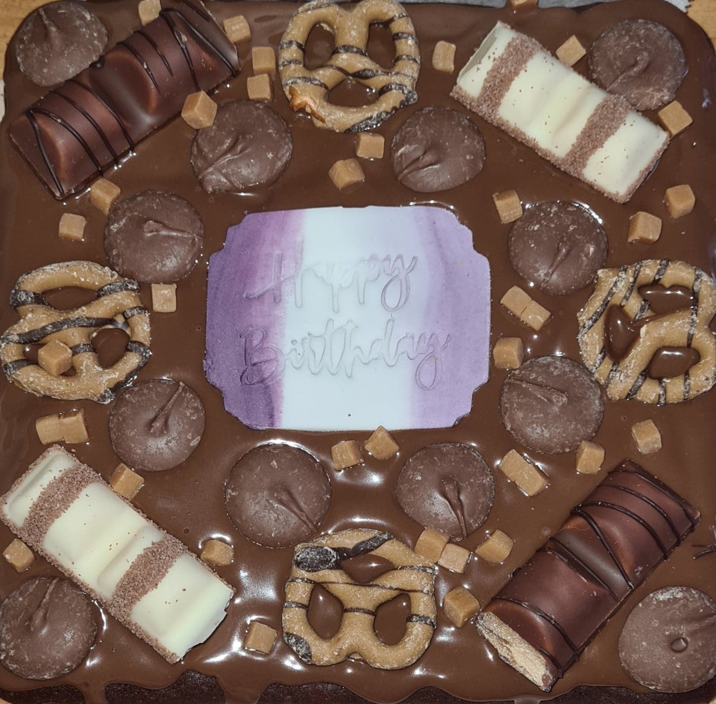 A happy birthday brownie tray, with kinder bueno, Cadburys chocolate buttons, fudge and pretzels!