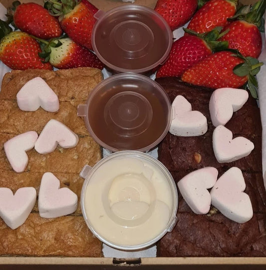 A dipping box, with brownies, blondies, strawberries, marshmellows and sauces of your choice!