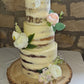 A beautiful wedding cake created for a relative of mine, a three tier cake topped with the bride and the groom.