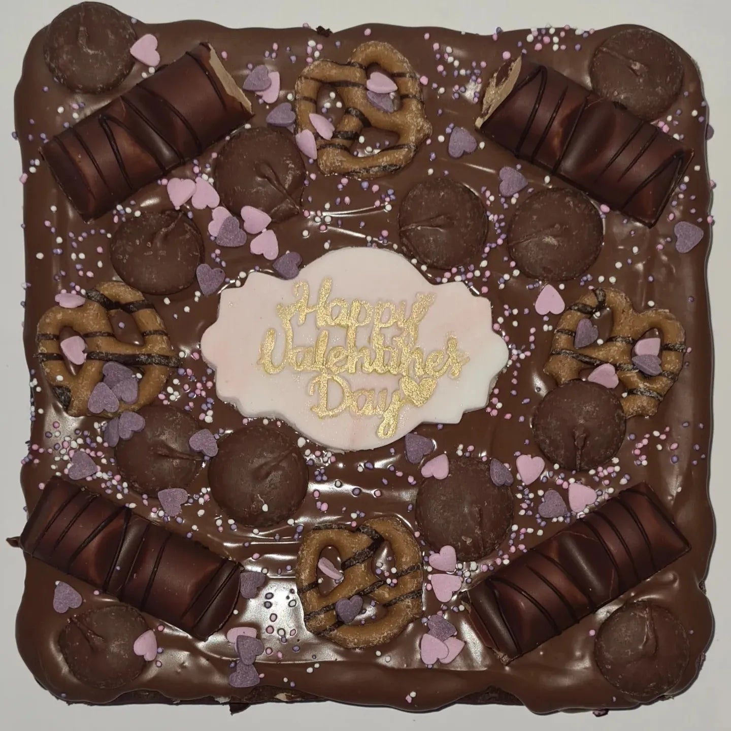 Happy valentines day brownie tray, covered with kinder bueno, pretzels, chocolate buttons and icing!