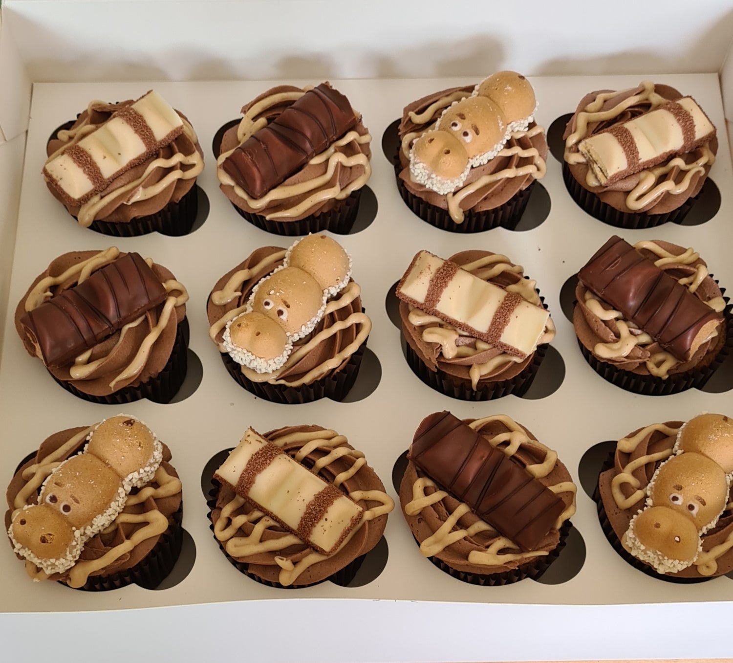 Kinder bueno cupcakes, topped with kinder bueno bars and hungry hippos! (Don't worry, they don't bite they are well trained!)